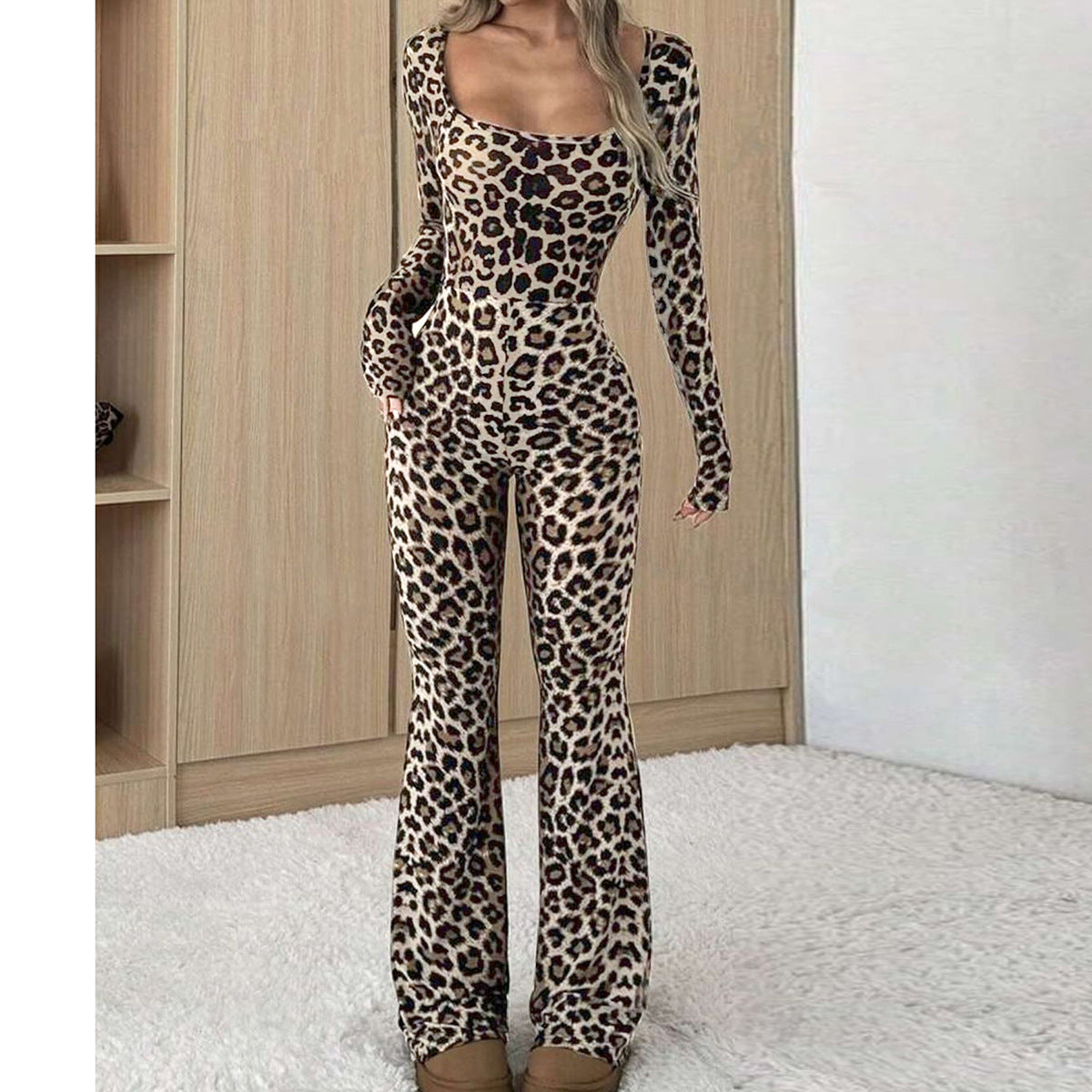 Women's slim-fit, long-sleeve leopard print jumpsuit featuring a square neckline and flared pant legs.