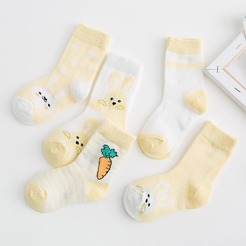 Five baby socks in pastel yellow and white with cute bunny and carrot prints on breathable cotton fabric.