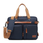 Navy blue multifunctional bag by Digitaldistribution375 with tan straps, brown leather accents, and dual front pockets.