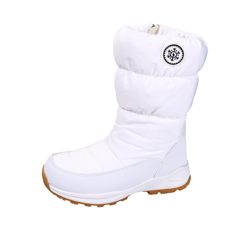 White mid-calf snow boot with quilted cotton upper, snowflake emblem, and a thick white sole with a brown tread.