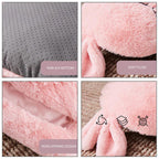 Pink plush USB shoe warmer features a soft, fuzzy texture, rear opening, and a gray non-slip dotted sole.