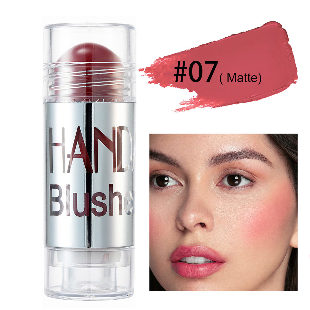 Matte rose blush stick in silver tube with swatch and model showing the shade on cheeks and lips.