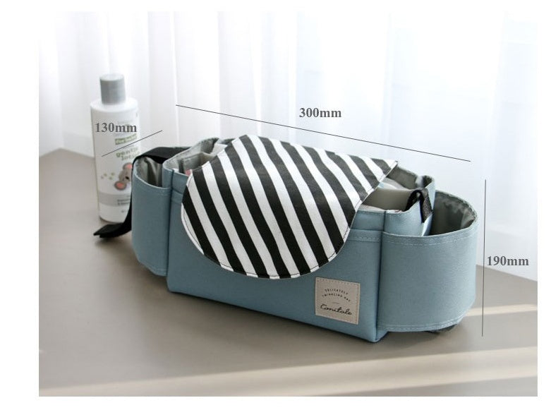 Blue fabric stroller organizer with a black-and-white striped flap, side cup holders, and labeled dimensions.