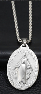 Silver-tone titanium steel necklace with an oval Miraculous Mary pendant on a twisted rope chain against black.
