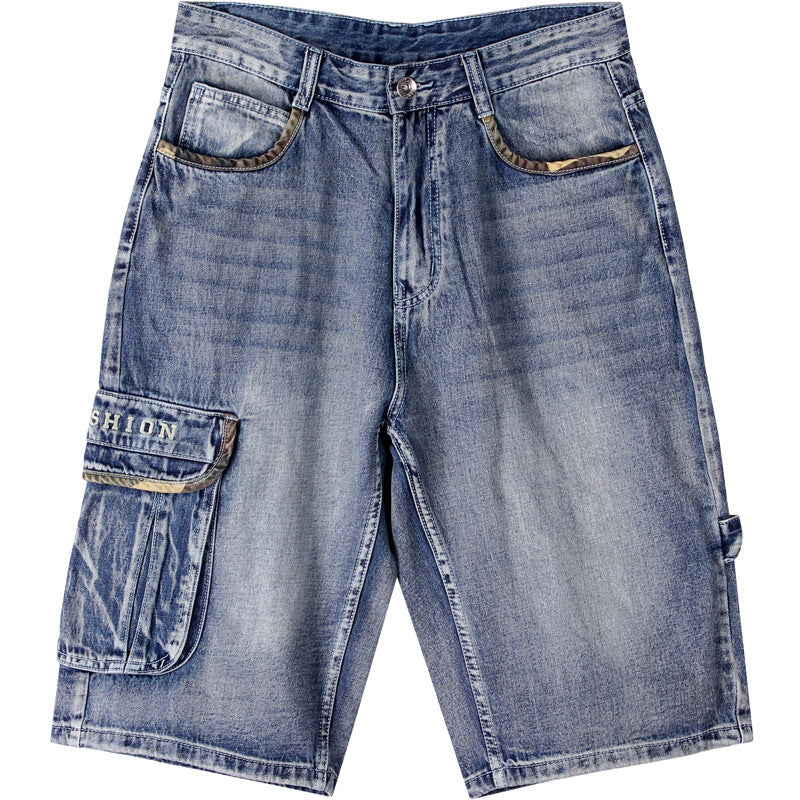 Blue denim hip-hop cargo shorts with camouflage pocket accents, a side flap pocket, and light wash finish.