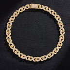 Gold-tone hip hop chain featuring infinity-shaped links fully paved with sparkling clear crystals against black fabric.