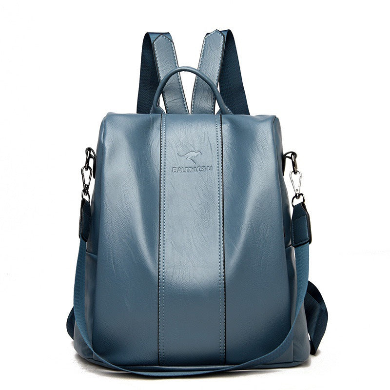 Blue soft leather convertible women’s backpack with a kangaroo logo and adjustable shoulder straps.