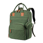 Olive green diaper backpack with tan leather accents, quilted front pocket, top handles, and a small detachable pouch.