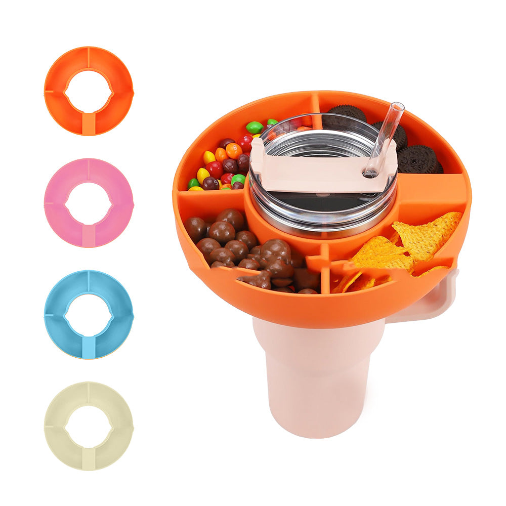 Orange silicone 4-compartment snack bowl attached to a pink tumbler, with extra colored rings shown to the left.