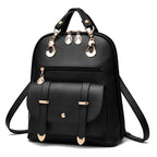 Black PU leather backpack with gold-tone hardware, front pocket with buckle straps, and top handle, white background.