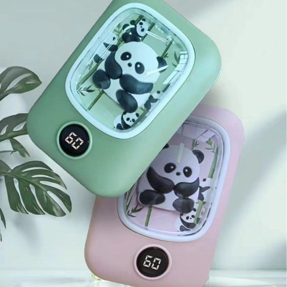 Two panda-themed, rechargeable hand warmers in sage green and blush pink, each with a digital temperature display.