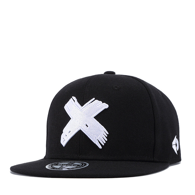 Black flat-brim baseball cap with a white embroidered "X" logo on the front and a small geometric icon on the side.