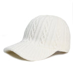 White baseball cap made of knitted wool with a textured cable-knit pattern and a solid-colored, ribbed brim.