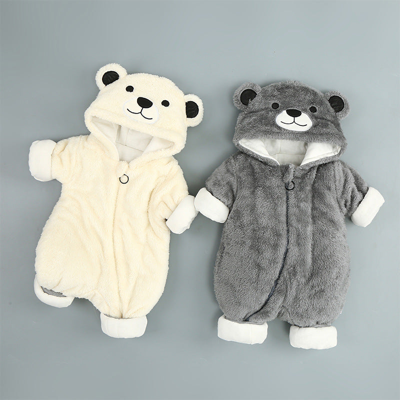 Two fuzzy, hooded baby bear onesies in cream and grey, featuring zipper fronts and soft fleece lining.