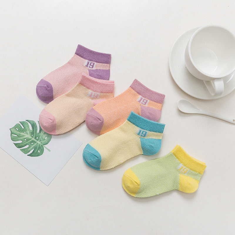 Four pairs of breathable cotton baby socks in pastel colors with "19" print, ankle cuffs, and contrast toes/heels.