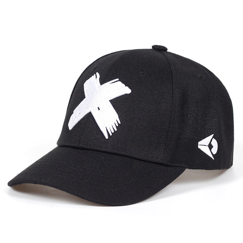 Black baseball cap with a white embroidered "X" on the front and a small geometric logo on the side.