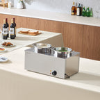 Commercial stainless steel soup warmer with two 6.34qt pots, temperature control knob, and indicator lights on a table.