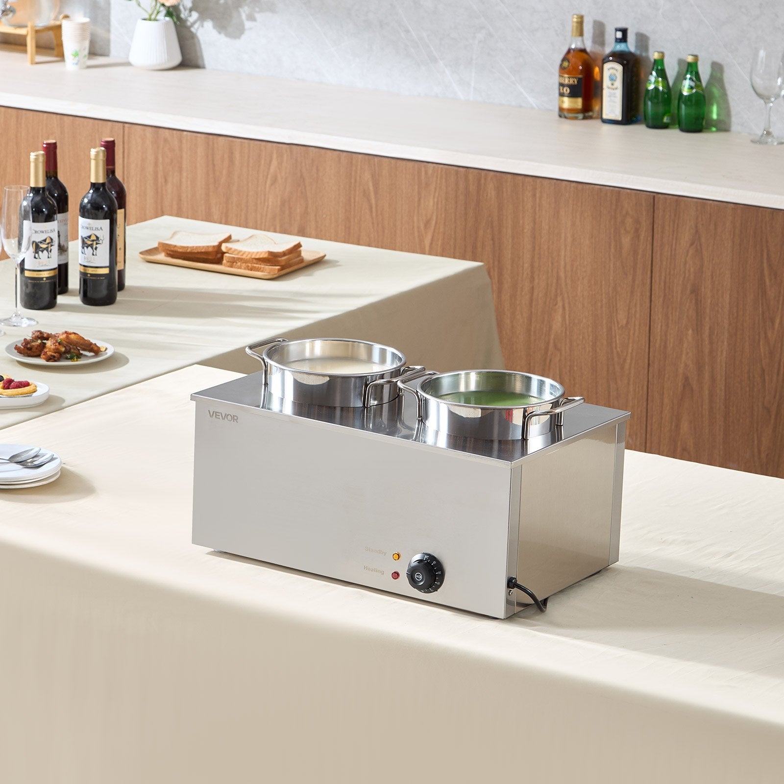 Commercial stainless steel soup warmer with two 6.34qt pots, temperature control knob, and indicator lights on a table.