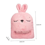Pink, fluffy plush rabbit-shaped shoe warmer with embroidered face and dimension measurements.