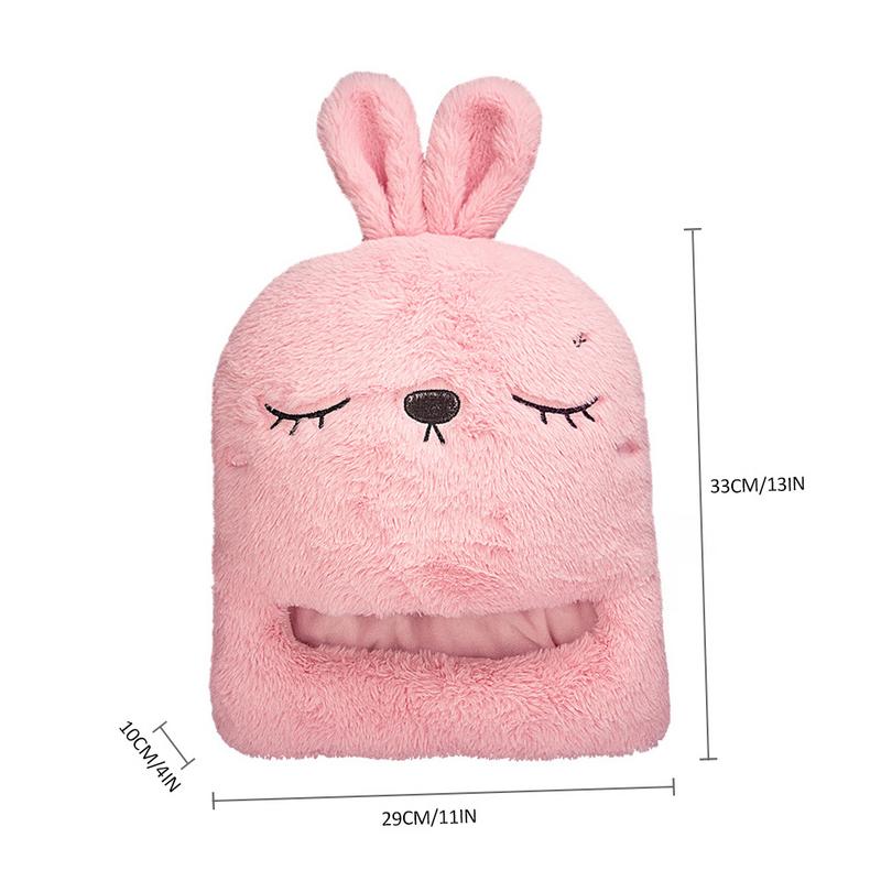 Pink, fluffy plush rabbit-shaped shoe warmer with embroidered face and dimension measurements.