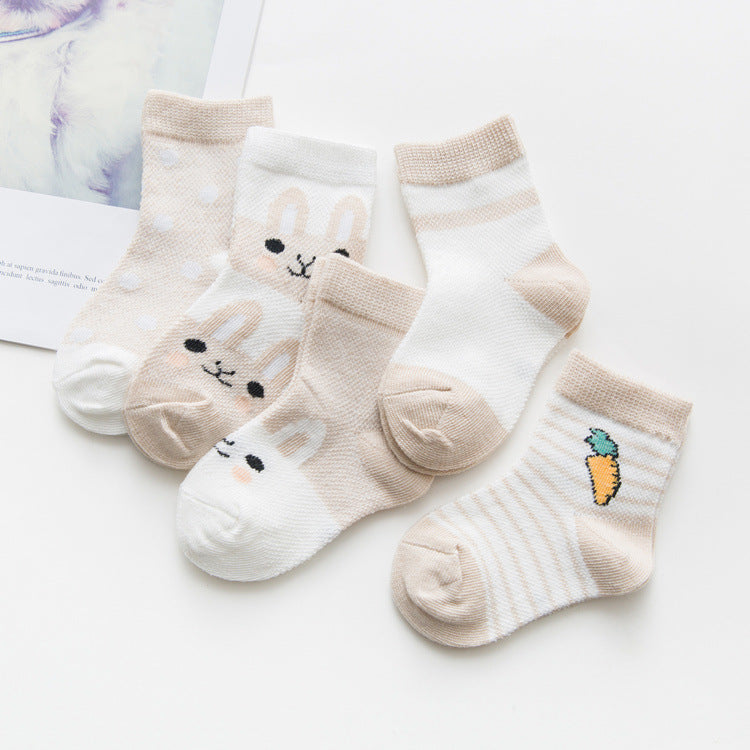 Breathable cotton baby socks by Digitaldistribution375 featuring neutral-toned rabbit, polka dot, and carrot patterns.