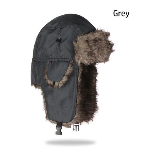 Grey waterproof trapper hat featuring a smooth shell, thick brown faux fur lining, ear flaps, and a chin buckle.