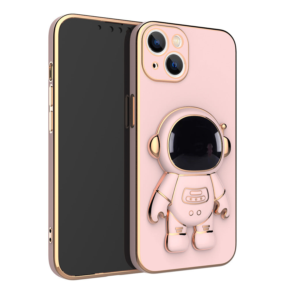 Pink phone case with gold electroplated trim and a 3D astronaut figure that serves as a kickstand.