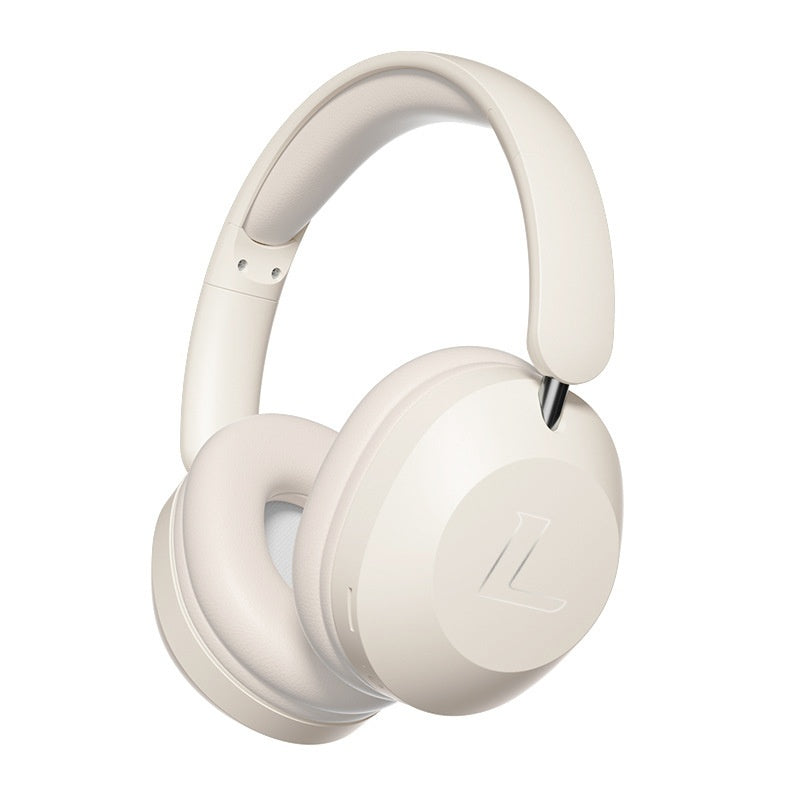Minimalist cream-colored wireless over-ear headphones with padded ear cups and a subtle embossed logo on the side.