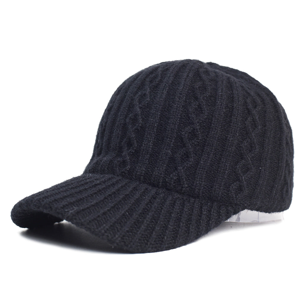 A black, cable-knit wool baseball cap featuring a ribbed brim and a cozy, textured design.