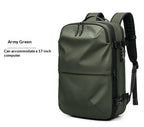 Army green minimalist travel backpack with locking zippers, side buckles, and space for a 17-inch laptop.