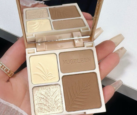 A Mugeleen four-pan contour and highlight makeup palette in a cream compact with embossed fern and leaf patterns.