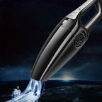 Sleek, black wireless handheld vacuum cleaner on a space background with abstract suction effects.