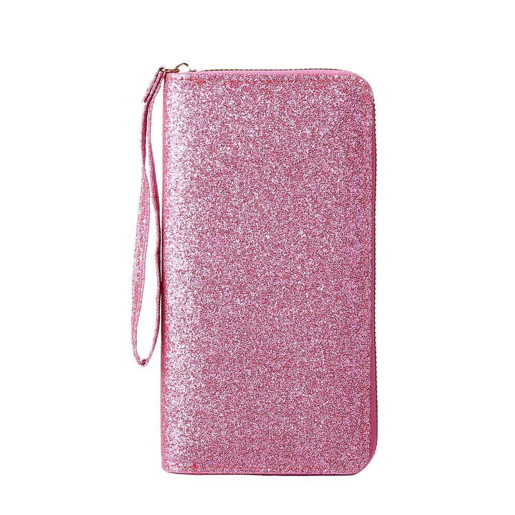 Pink glittery zip-around women's clutch wallet featuring a convenient matching wrist strap, isolated on white.