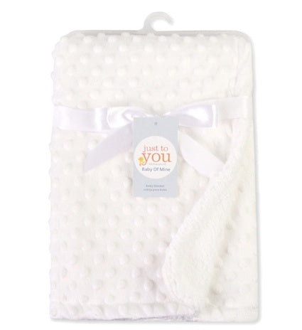 White plush baby blanket with raised dots, tied with a satin ribbon and labeled "Just to You."