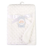 White plush baby blanket with raised dots, tied with a satin ribbon and labeled "Just to You."