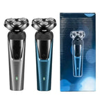 Two electric rotary shavers in grey and blue with triple heads, power buttons, and battery indicators next to a box.