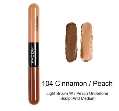Double-ended Phoera concealer stick in 104 Cinnamon/Peach, showing swatches of light and dark brown cream makeup.