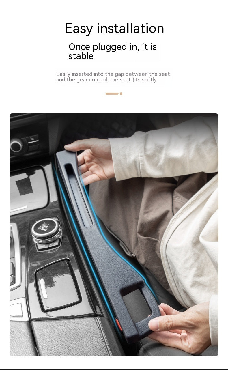 Black plastic car seat gap storage organizer being installed between a vehicle seat and the center console.