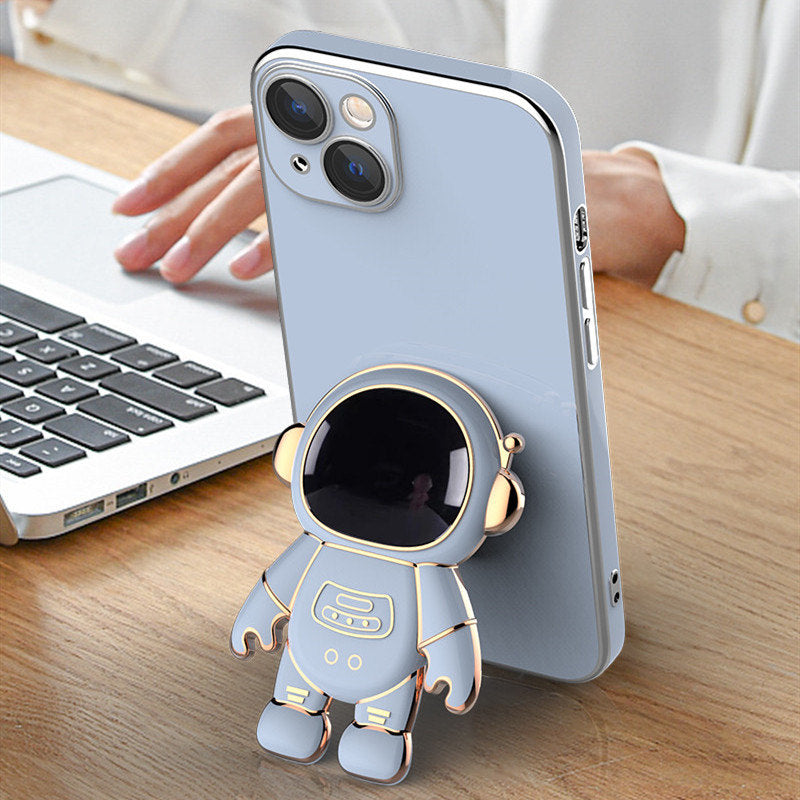 Light blue anti-drop phone case with a 3D electroplated gold-trimmed astronaut kickstand on the back.