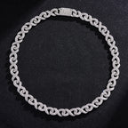 Silver-toned hip hop chain featuring infinity-shaped links encrusted with sparkling crystals against a black background.