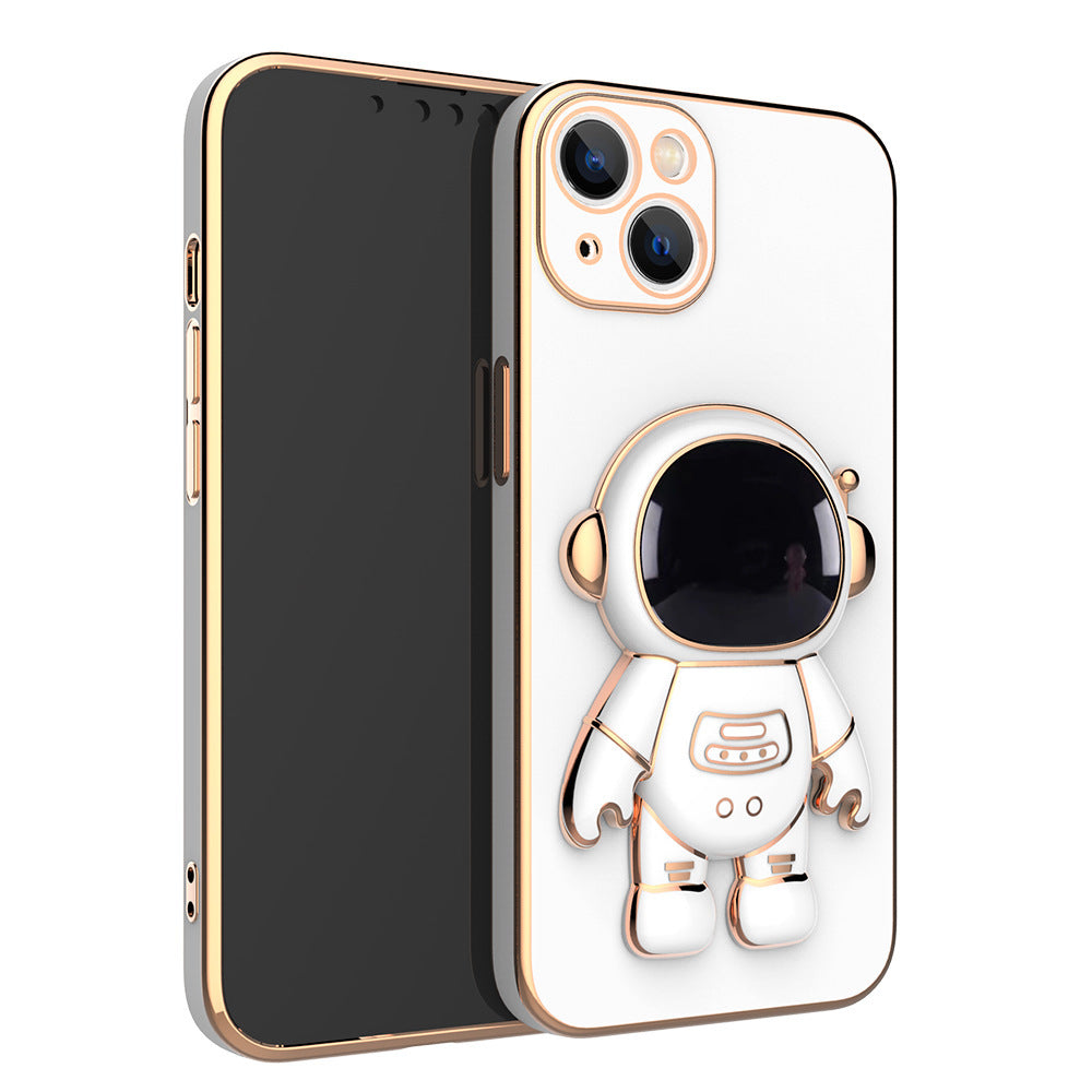 White phone case with gold electroplated trim and a 3D astronaut figure acting as a stand on the back.