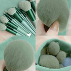 13-piece sage green makeup brush set with soft, synthetic bristles and matching handles in a coordinating fabric bag.