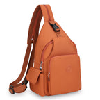 Rust-orange waterproof crossbody chest bag with adjustable strap, multiple zippered pockets, and plastic buckle closure.