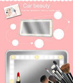 Rectangular car sun visor mirror with LED touch lights on a pink background, featuring makeup brushes and lipstick.
