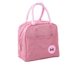 Pink cationic waterproof lunch bag with thermal insulation, zippered closure, front pocket, and pale pink handles.