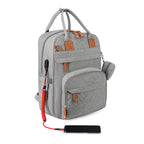 Grey fabric stroller backpack with brown leather accents, external USB charging cable, and phone on white background.