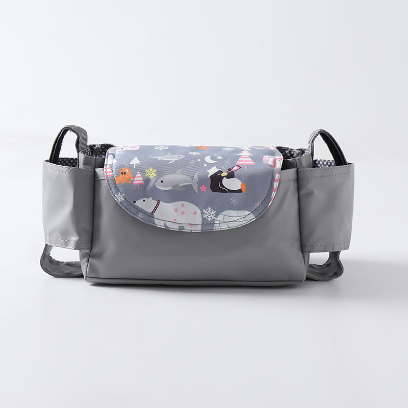 Grey baby stroller organizer bag with side cup holders and a flap featuring a whimsical arctic animal print.