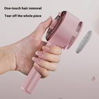 A hand holds a pink, self-cleaning steam pet brush with a one-touch button for easy hair removal.