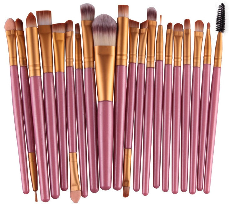 A Digitaldistribution375 set of 20 makeup brushes with metallic gold ferrules, pink wooden handles, and soft bristles.
