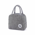 Grey waterproof cationic fabric lunch bag with carry handles, zippered top, and a circular panda thermal label.
